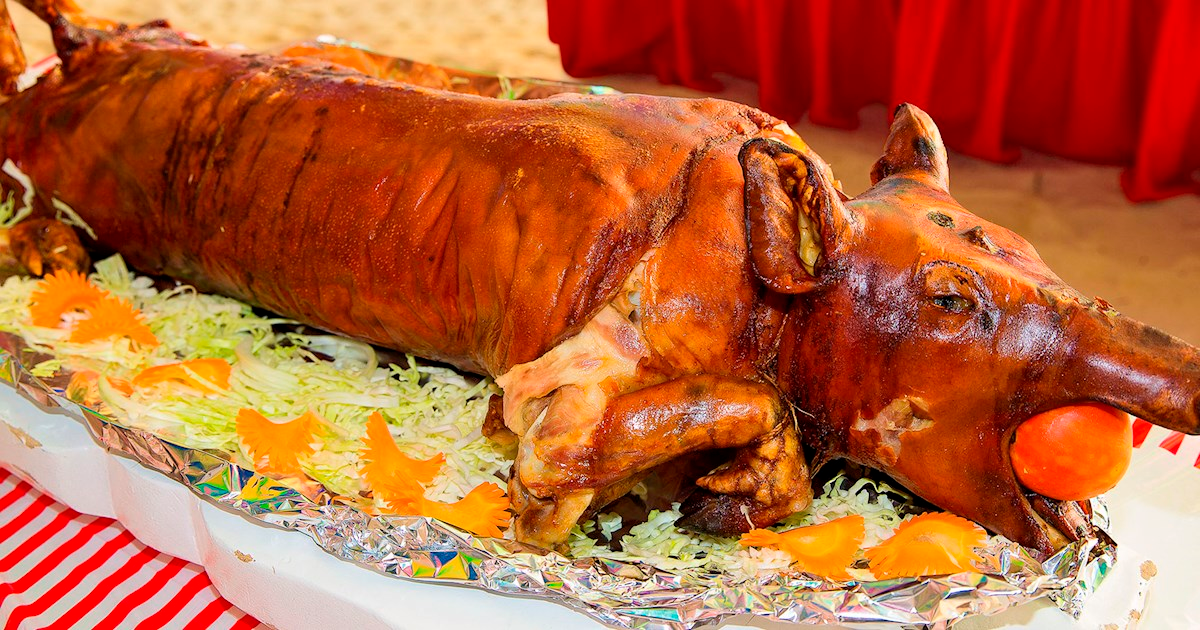 Cebu Lechon on Traditional Serving Table Whole roasted lechon displayed on a serving table in Cebu